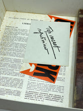 Load image into Gallery viewer, Close-up of a cigarette pack against a natural background.