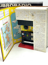 Load image into Gallery viewer, Detail view of an open box with contents including a map and text.