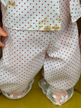 Load image into Gallery viewer, Close-up of Sebino doll's pants with a polka dot pattern and elastic waistband.