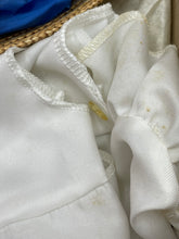 Load image into Gallery viewer, Detail view of white fabric with a soft texture, folded.
