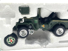 Load image into Gallery viewer, Packaging view of the military toy vehicle with detailed wheels and military design.
