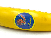 Load image into Gallery viewer, Furga mini Banana Doll side view featuring yellow banana and sticker label.