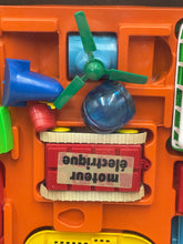 Load image into Gallery viewer, Detail view of colorful toy parts from Tomy Jouets Mont Blanc Multi mobile with various shapes.