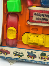 Load image into Gallery viewer, Detail view of colorful toy parts from Tomy Jouets Mont Blanc Multi mobile with various shapes.