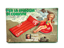 Load image into Gallery viewer, Italocremona doll set packaging front view featuring a girl on an inflatable pool float.