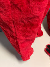 Load image into Gallery viewer, Detail view of red plush fabric with a pointed edge.
