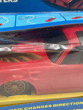 Carica l'immagine nel visualizzatore di Gallery, Close-up detail of the red toy car showcasing its intricate design.