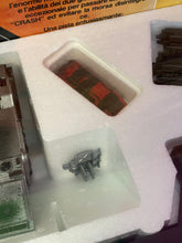 Load image into Gallery viewer, Tyco Racing Warriors various small items close-up showing plastic packaging and components.