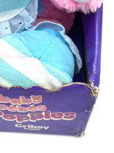 Load image into Gallery viewer, Detail of colorful plush toy showing soft texture and box packaging.