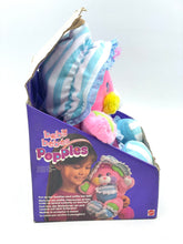 Load image into Gallery viewer, Side view of colorful plush toy featuring a striped hat and box packaging.