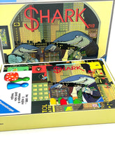 Load image into Gallery viewer, Ravensburger Vintage Board Game Shark open lifestyle shot with game components displayed.