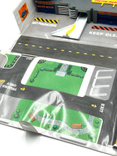 Load image into Gallery viewer, Galoob Micro Machines Truck 'N Service Centre packaging highlighting the play area with road markings.
