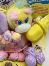 Carica l'immagine nel visualizzatore di Gallery, Close-up detail of yellow Turtle Tots plush toy with big eyes and colorful patterns.