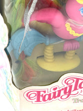 Load image into Gallery viewer, Close-up of the toy figure inside packaging with vibrant colors.