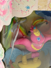 Load image into Gallery viewer, Detail view of the toy inside packaging showcasing colorful accessories.