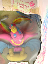 Load image into Gallery viewer, Close-up of the colorful toy figure featuring large eyes and feathers.