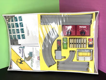 Load image into Gallery viewer, Detailed view of vehicles included in the Tyco US1 Motorcity Set