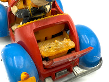 Load image into Gallery viewer, Close-up of Politoys M554 Donald Duck Car showing restoration needs and vintage wear