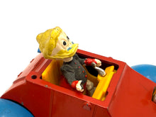 Load image into Gallery viewer, Close-up of Politoys W3 Grandma Duck car showing restoration needs and vintage wear