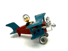 Load image into Gallery viewer, Side view of Politoys W7 Donald Duck airplane showing vintage details