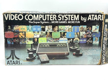 Load image into Gallery viewer, Atari VCS 2600 Woody console box front view with colorful graphics.
