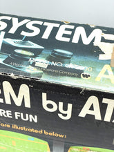 Load image into Gallery viewer, Atari game system box with graphic design and brand logo.
