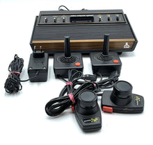Load image into Gallery viewer, Atari VCS 2600 Woody console with joystick and paddle controllers.

