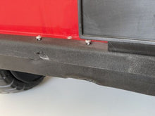 Load image into Gallery viewer, Detail view of the battery compartment and wiring inside the Jeep.
