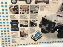 Load image into Gallery viewer, Rear view of the Peg Perego ride-on car highlighting the vintage model details.
