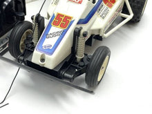 Load image into Gallery viewer, Close-up of the wheels on the vintage Nikko frame buggy.
