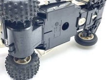 Load image into Gallery viewer, Side view of the remote control car highlighting large tires.
