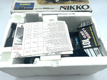 Load image into Gallery viewer, Nikko Black Cat Laser 4WD model kit components and instruction manual.
