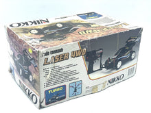 Load image into Gallery viewer, Nikko Black Cat Laser 4WD side view highlighting the remote control features.
