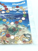 Load image into Gallery viewer, Packaging view of the game board with an ocean theme and colorful tokens.
