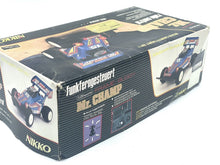 Load image into Gallery viewer, Nikko RC buggy inside box showing car model and controller in styrofoam packaging.
