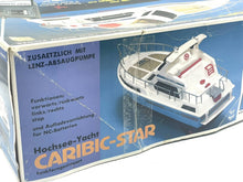 Load image into Gallery viewer, Front view of Vintage Nikko Caribic Star Speed Cruiser featuring detailed graphics and remote control.
