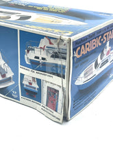Load image into Gallery viewer, Packaging of Vintage Nikko Caribic Star Speed Cruiser with detailed graphics and window display.
