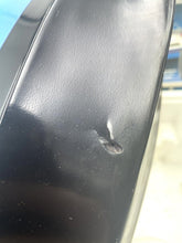 Load image into Gallery viewer, Detail view of the toy boat showing a dent on the black plastic material.
