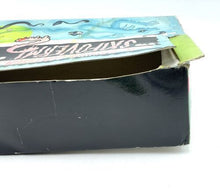 Load image into Gallery viewer, Side view of a colorful lottery ticket box with an open top and graphic design.
