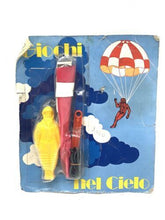 Load image into Gallery viewer, Giolitto vintage toy set packaging featuring a parachute and toy figure with cloud graphics.

