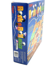 Load image into Gallery viewer, Tomy Tricky Traps Rock’n Roll game side view showcasing colorful graphics.
