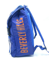 Load image into Gallery viewer, Side view of the blue backpack showcasing text design.
