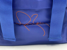 Load image into Gallery viewer, Detail of the handwritten style signature on the backpack.
