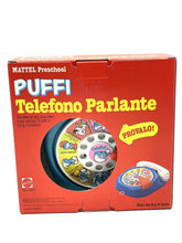 Load image into Gallery viewer, Front view of THE SMURFS I PUFFI IL TELEFONO PARLANTE MATTEL packaging featuring colorful graphics and toy illustration.
