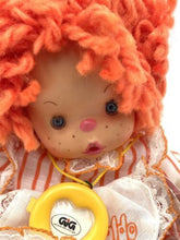 Load image into Gallery viewer, Close-up detail of Patapouf New Girl doll's face showing big eyes and yellow pacifier.
