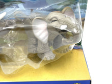 Load image into Gallery viewer, Close-up detail of a gray and white toy animal figure with realistic design.
