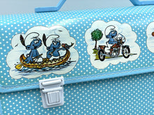 Load image into Gallery viewer, Detail view of the blue Smurfs school bag showing the lock clasp.
