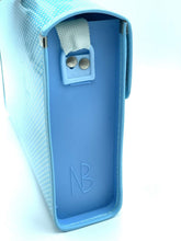 Load image into Gallery viewer, Close-up detail of the blue Smurfs school bag highlighting stickers and lock clasp.
