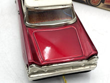 Load image into Gallery viewer, Detail view of the shiny red vintage car with chrome accents.
