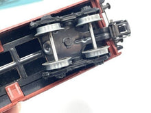 Load image into Gallery viewer, Marklin H0 - 4626 close-up detail of the train car underside featuring wheel assembly and coupler.
